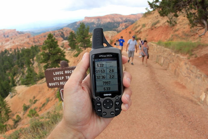 man holding in his arm waterproof Handheld GPS for hiking