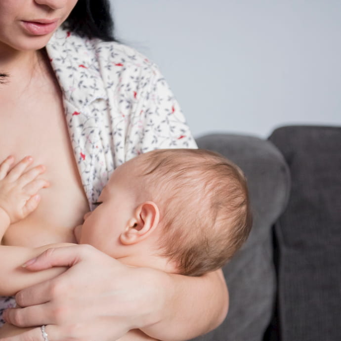 mother breastfeeding baby son