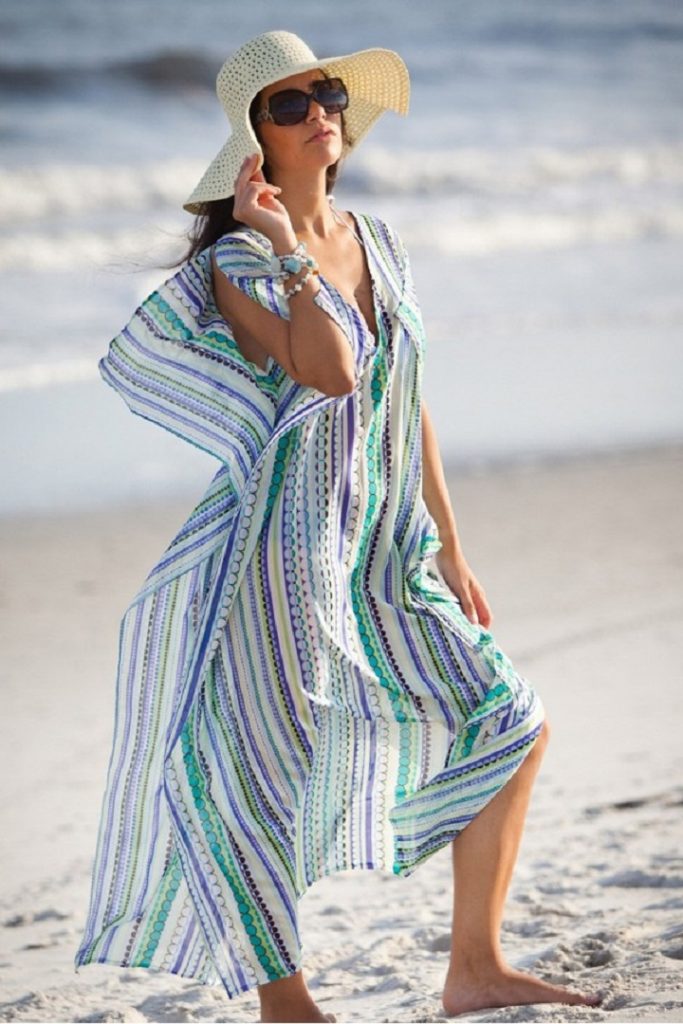 picture of woman in the beach wearing kaftan