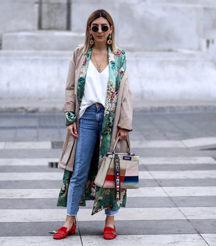 picture of woman standing on sidewalk wearing stylish clothes 