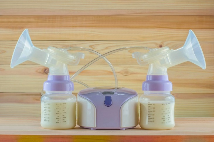 picture of electric breast pumps on a wooden panel