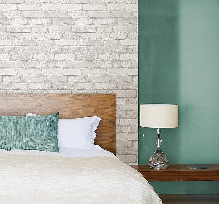brick wallpaper accent wall in bedroom