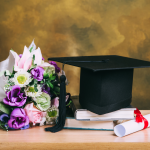 graduation hat with flowers and diploma