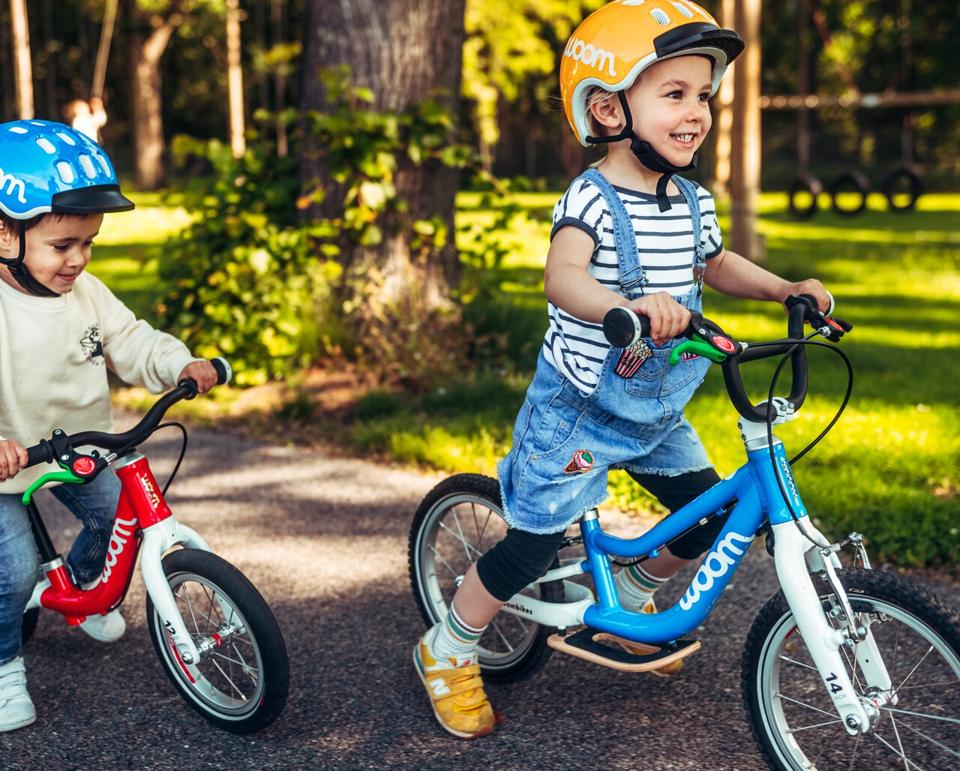 toddlers riding balance bikes