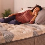 Woman sleeping on bed mattress